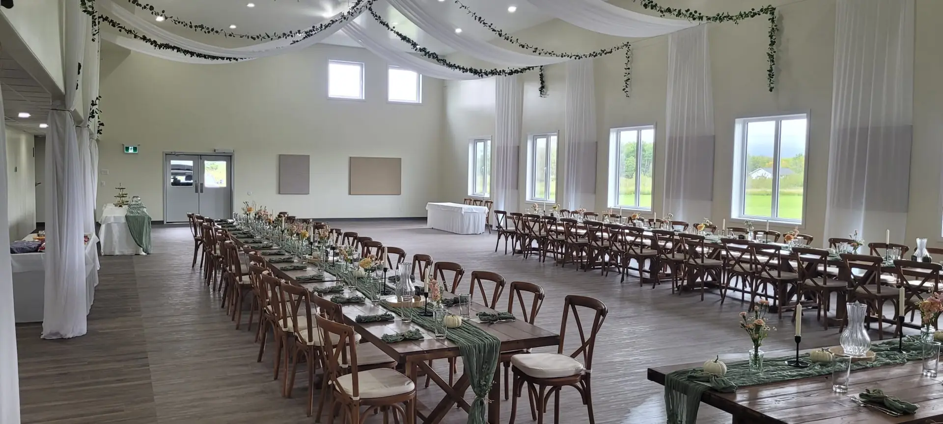 Rounds of eight set with linens in the hall, dressed by the family who booked it